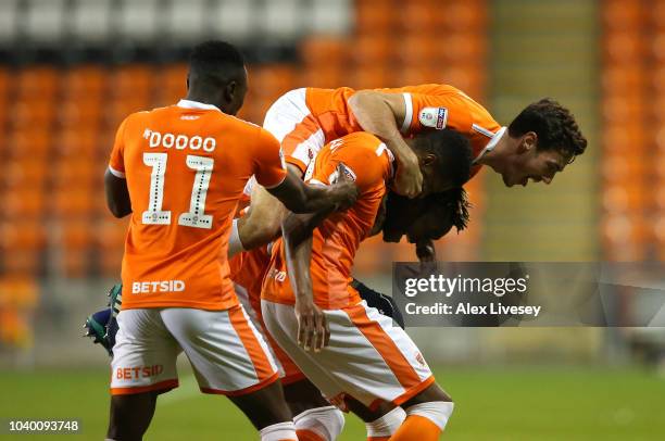 Armand Gnanduillet of Blackpool celebrates with team mates after scoring the opening goal during the Carabao Cup Third Round match between Blackpool...