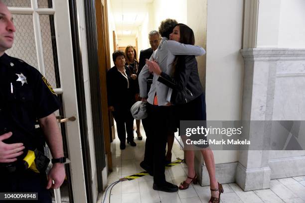 Bill Cosby accusers Andrea Constand and Janice Dickinson embrace after he was sentenced to 3-10 years in the assault retrial at the Montgomery County...