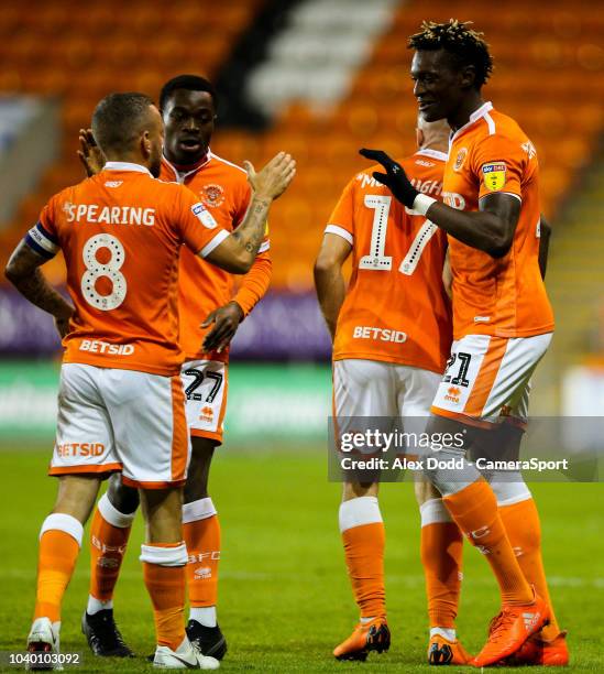 Blackpool's Jay Spearing congratulates Armand Gnanduillet after he opened the scoring during the Carabao Cup Third Round match between Blackpool and...