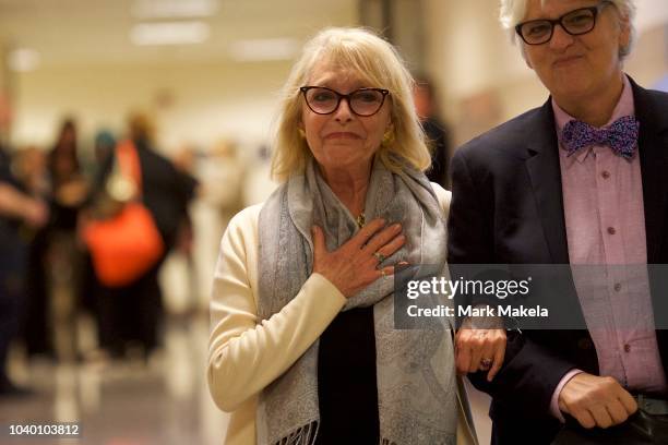 Bill Cosby accuser Victoria Valentino and friend Lisa Talmadge react after he was sentenced to 3-10 years in the assault retrial at the Montgomery...