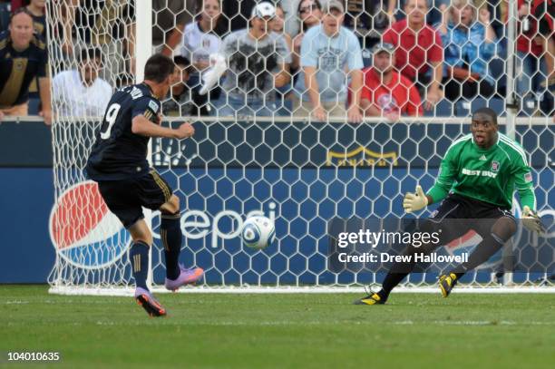 Sebastien Le Toux of the Philadelphia Union shoots and scores on goalkeeper Sean Johnson of the Chicago Fire at PPL Park on September 11, 2010 in...