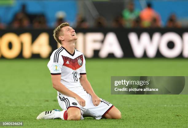 Toni Kroos of Germany celebrates after winning the FIFA World Cup 2014 final soccer match between Germany and Argentina at the Estadio do Maracana in...