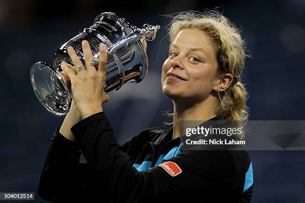 Kim Clijsters of Belguim kisses with the trophy in celebration of her win over Vera Zvonareva of Russia during their women's singles final on day...