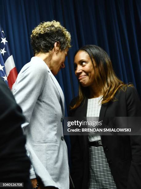 Accuser Andrea Constand speaks with prosecutor Kristen Feden during a press conference on September 25, 2018 in Norristown, Pennsylvania, after...