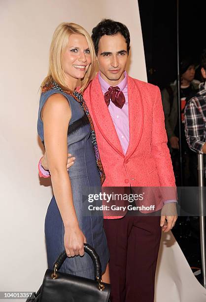 Actress Claire Danes and designer Zac Posen pose for pictures backstage after attending the Z Spoke by Zac Posen Spring 2011 fashion show during...