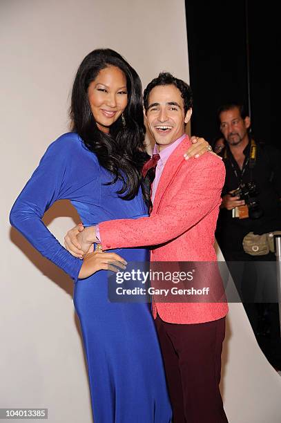 Creative director Kimora Lee Simmons and designer Zac Posen pose for pictures backstage after attending the Z Spoke by Zac Posen Spring 2011 fashion...