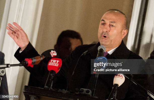 Turkish Minister of Foreign Affairs Mevluet Cavusoglu speaks to his supporters in the garden of the Turkish consul general at the Aussenalster river...
