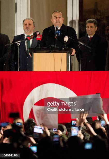 Turkish Minister of Foreign Affairs Mevluet Cavusoglu speaks to his supporters in the garden of the Turkish consul general at the Aussenalster river...