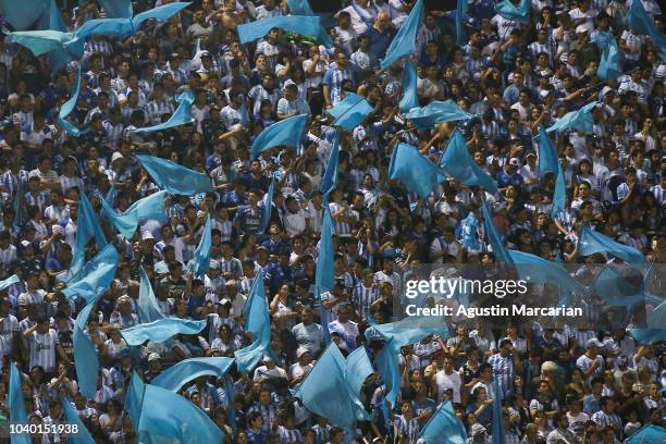 Fans of Atletico Tucuman cheer for their team during a quarter final first leg match between Atletico Tucuman and Gremio as part of Copa CONMEBOL...