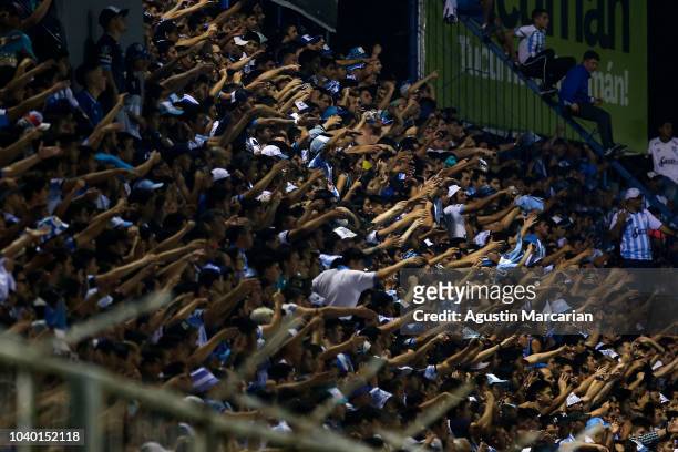 Fans of Atletico Tucuman cheer for their team during a quarter final first leg match between Atletico Tucuman and Gremio as part of Copa CONMEBOL...