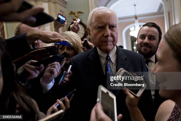 Senator Orrin Hatch, a Republican from Utah, speaks to members of the media after a weekly caucus meeting at the U.S. Capitol in Washington, D.C.,...