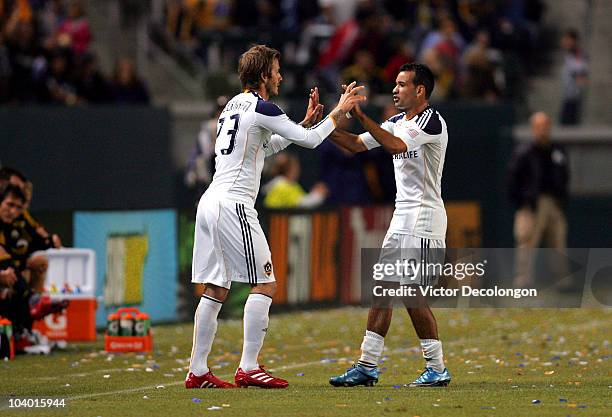 David Beckham of the Los Angeles Galaxy substitutes into the game for Juninho in the second half during their MLS match against Columbus Crew at The...