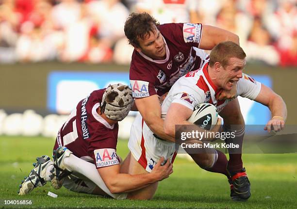 Ben Creagh of the Dragons is tackled during the NRL Fourth Qualifying Final match between the St George Illawarra Dragons and the Manly Warringah Sea...