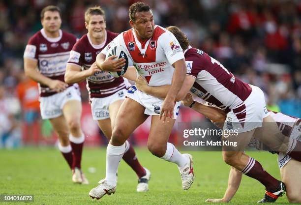 Neville Costigan of the Dragons takes on the defence during the NRL Fourth Qualifying Final match between the St George Illawarra Dragons and the...