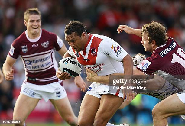 Neville Costigan of the Dragons takes on the defence during the NRL Fourth Qualifying Final match between the St George Illawarra Dragons and the...
