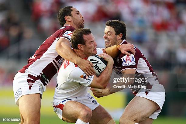 Dean Young of the Dragons is tackled during the NRL Fourth Qualifying Final match between the St George Illawarra Dragons and the Manly Warringah Sea...