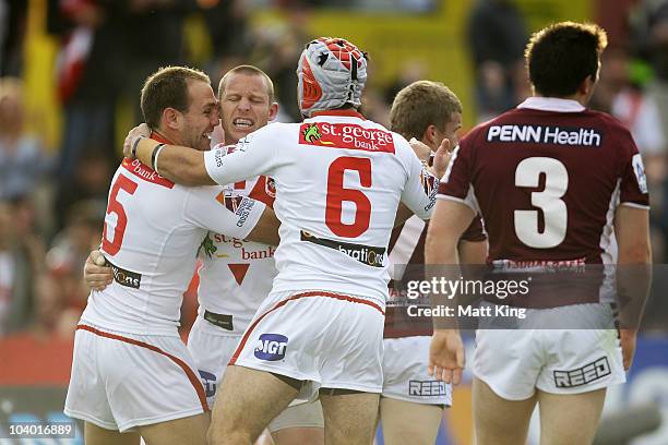 Ben Hornby of the Dragons celebrates with team mates after scoring a first half try during the NRL Fourth Qualifying Final match between the St...