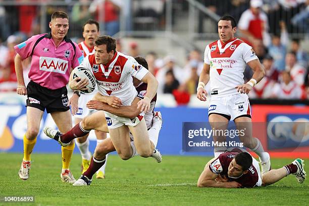 Brett Morris of the Dragons is tackled during the NRL Fourth Qualifying Final match between the St George Illawarra Dragons and the Manly Warringah...