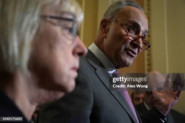 Senate Minority Leader Sen. Chuck Schumer speaks as Sen. Patty Murray listens after a weekly Senate Democratic policy luncheon September 25, 2018 at...