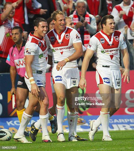 Darius Boyd congratulates Mark Gasnier of the Dragons after he scored a try during the NRL Fourth Qualifying Final match between the St George...