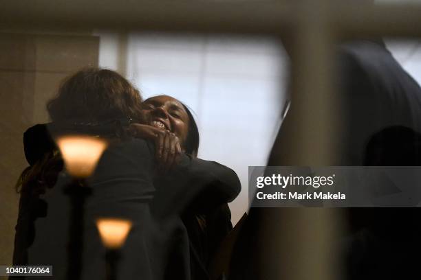 Co-prosecutor Kristen Gibbons Feden embraces a friend before Bill Cosby was sentenced to 3-10 years in the assault retrial at the Montgomery County...