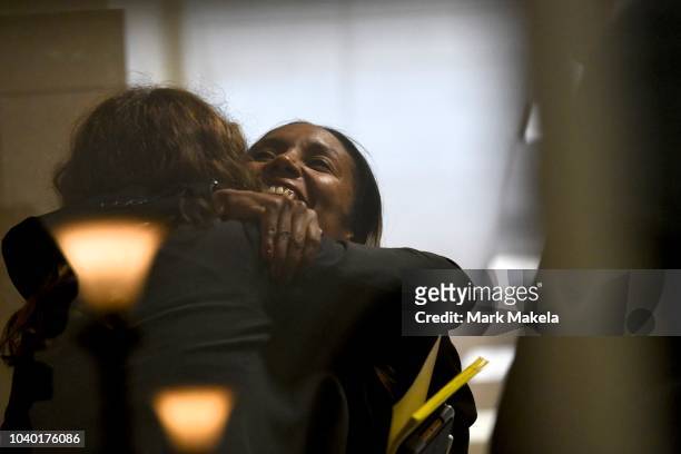 Co-prosecutor Kristen Gibbons Feden embraces a friend before Bill Cosby was sentenced to 3-10 years in the assault retrial at the Montgomery County...