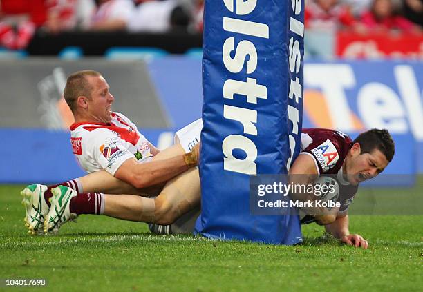 Ben Farah of the Eagles is tackled in the post by Ben Hornby of the Dragons during the NRL Fourth Qualifying Final match between the St George...