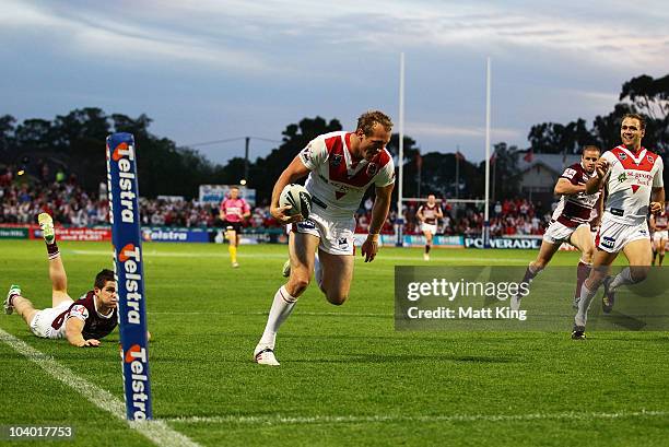 Mark Gasnier of the Dragons crosses the line to score a try during the NRL Fourth Qualifying Final match between the St George Illawarra Dragons and...