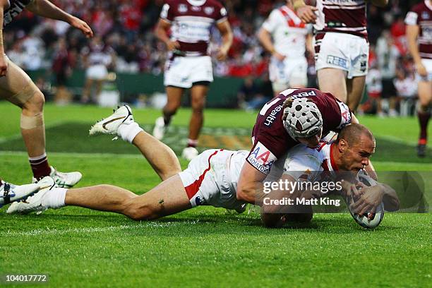Matt Cooper of the Dragons dives over the line to score his first try during the NRL Fourth Qualifying Final match between the St George Illawarra...
