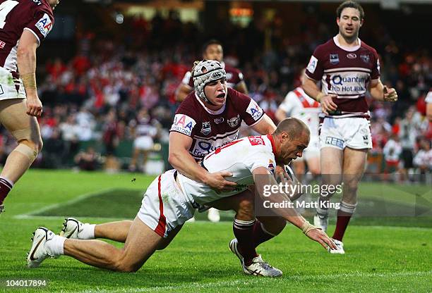 Matt Cooper of the Dragons dives over the line to score his first try during the NRL Fourth Qualifying Final match between the St George Illawarra...