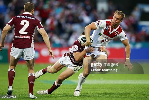 Mark Gasnier of the Dragons takes on the defence during the NRL Fourth Qualifying Final match between the St George Illawarra Dragons and the Manly...