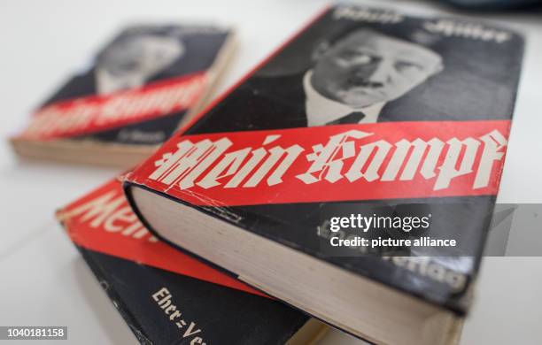 Various edition of Adolf Hitler's book "Mein Kampf" featuring a portrait of Hitler, photographed at the Institut fuer Zeitgeschichte in Munich,...