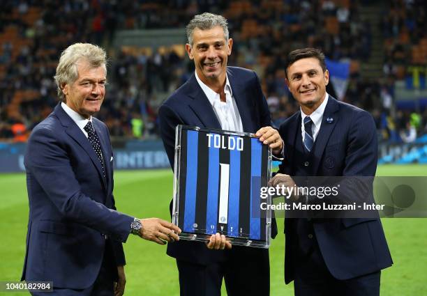 Giancarlo Antognoni, Francesco Toldo and Javier Zanetti pose whit shirt before the serie A match between FC Internazionale and ACF Fiorentina at...