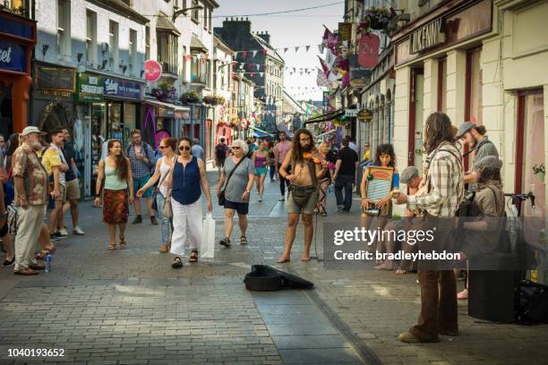 buskers playing music on the streets of galway, ireland - irish folk band stock pictures, royalty-free photos & images