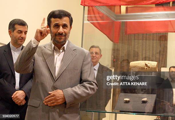 Iranian President Mahmoud Ahmadinejad gestures during the unveiling on the Cyrus Cylinder, at the National Museum of Iran in Tehran on September 12,...