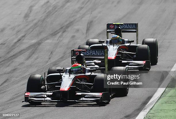 Sakon Yamamoto of Japan and Hispania Racing Team drives ahead of team mate Bruno Senna of Brazil and Hispania Racing Team during the Italian Formula...