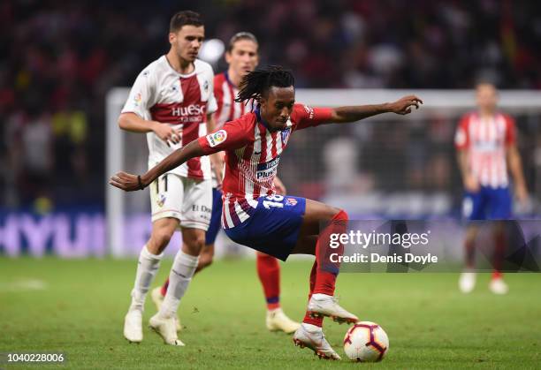 Gelson Martins of Club Atletico de Madrid turns from Alex Gallar of SD Huesca a during the La Liga match between Club Atletico de Madrid and SD...