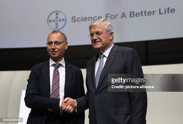 Werner Baumann, CEO of Bayer AG, with Werner Wenning , the chairman of the board of directors, at the company's general meeting in Bonn, Germany, 28...