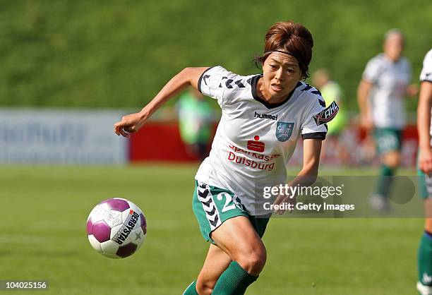 Kozue Ando of Duisburg runs with the ball during the Women's bundesliga match between FCR Duisburg and FFC Frankfurt at the PCC-Stadium on September...