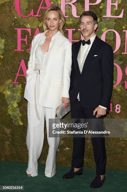 Amber Valletta and Simon Holloway attend the Green Carpet Fashion Awards at Teatro Alla Scala on September 23, 2018 in Milan, Italy.