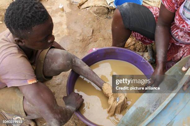 Year-old Richmond Asiamah working with mercury at a gold mine in Brong-Ahafo, Ghana, 15 September 2016. The toxic, liquid metal is used to extract...