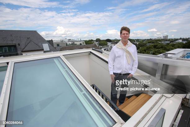 Xing founder and building contractor of the 'Apartimentum,' Lars Hinrichs, stands on the roof terrace of a 260-square-meter apartment in the...