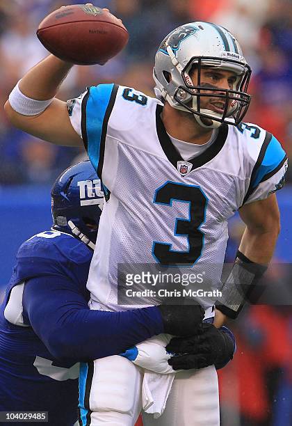 Matt Moore of the Carolina Panthers is sacked by Barry Cofield of the New York Giants during the NFL season opener at New Meadowlands Stadium on...