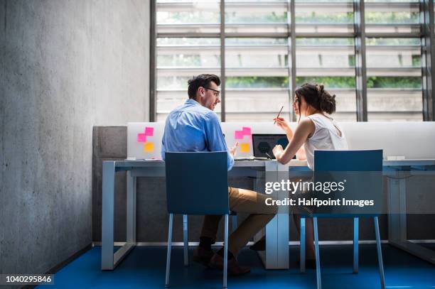 young business people in the modern office working together. - business sunlight stock pictures, royalty-free photos & images