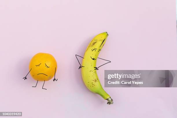 sad orange and happy banana.diet  concept - fat loss stock-fotos und bilder