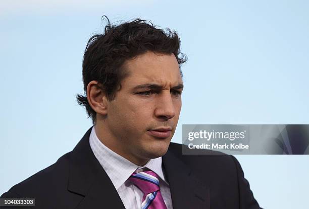 Billy Slater of the Melbourne Storm and guest of the Channel Nine commentary team looks on during their pre-match show on the sideline before the NRL...