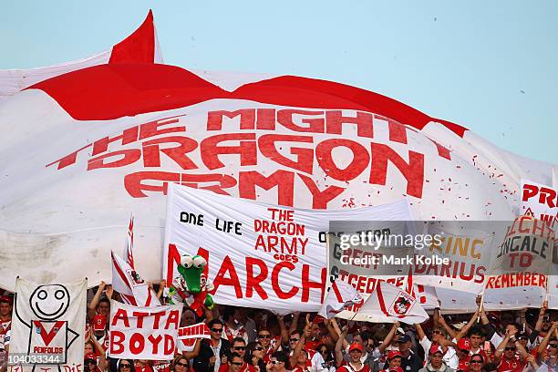 The Dragons supporters in the crowd cheers as their team takes the field during the NRL Fourth Qualifying Final match between the St George Illawarra...