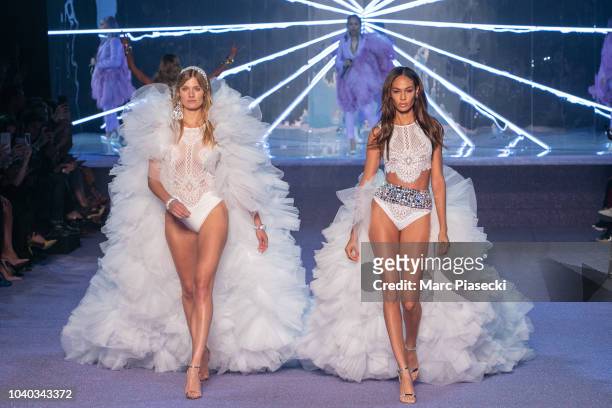 Models Constance Jablonski and Joan Smalls walk the runway at the ETAM show as part of the Paris Fashion Week Womenswear Spring/Summer 2019 on...