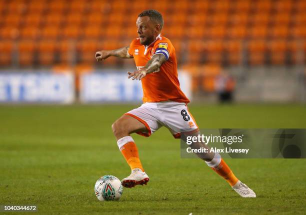 Jay Spearing of Blackpool runs with the ball during the Carabao Cup Third Round match between Blackpool and Queens Park Rangers at Bloomfield Road on...