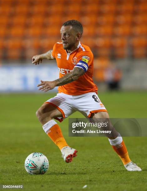 Jay Spearing of Blackpool runs with the ball during the Carabao Cup Third Round match between Blackpool and Queens Park Rangers at Bloomfield Road on...